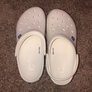 white crocs with black stripe